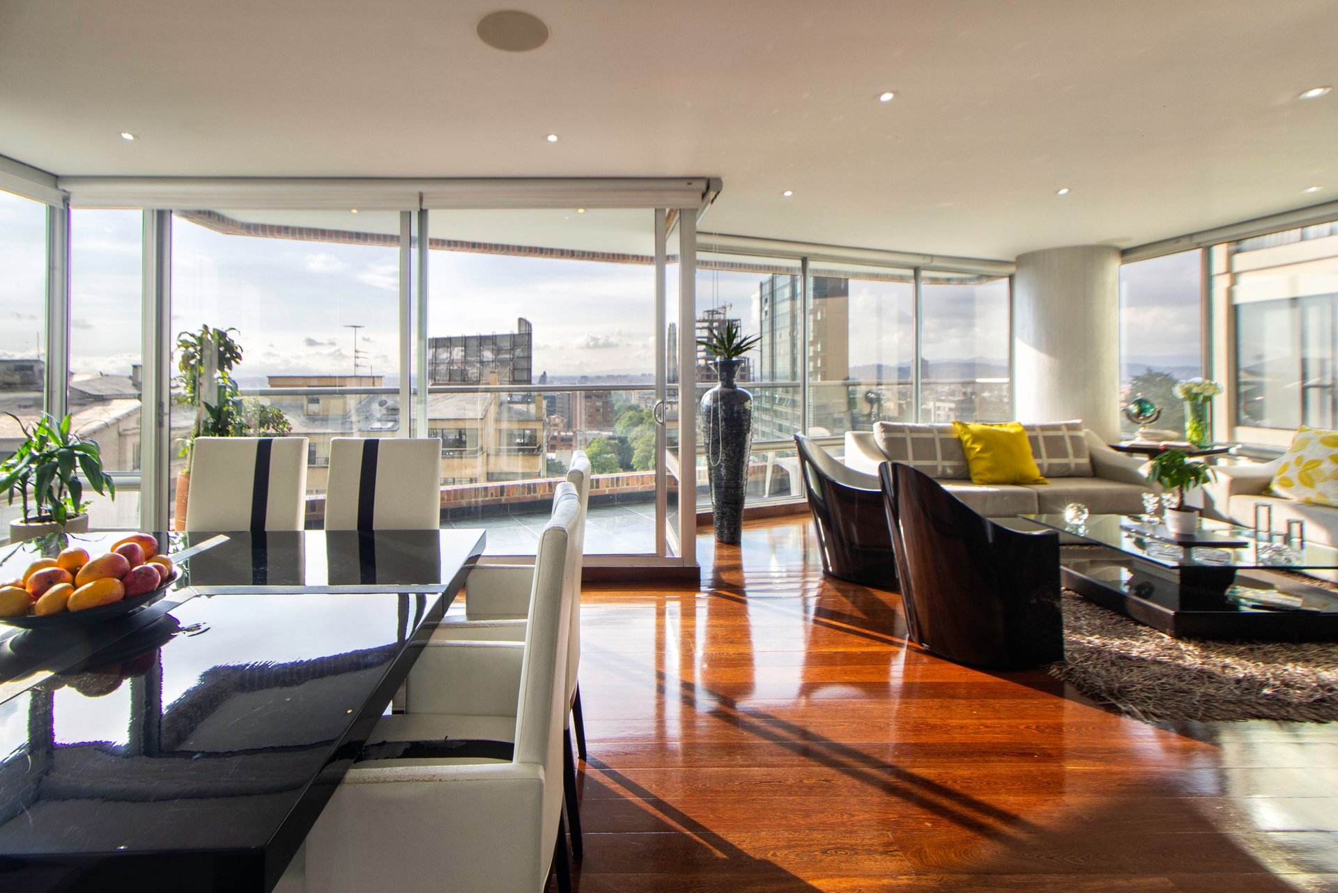 Bright apartment living space with floor-to-ceiling windows